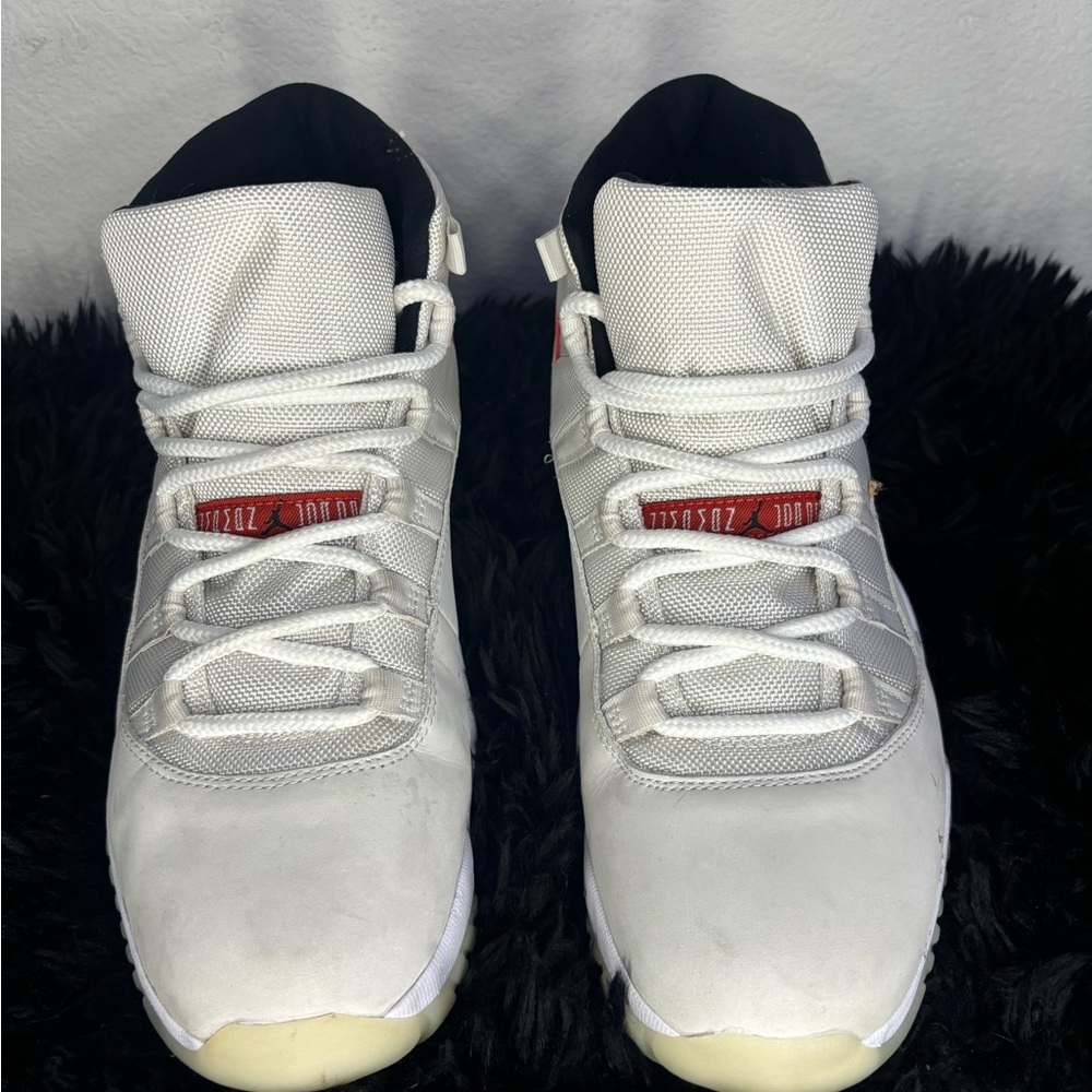Air Jordan 11 Platinum Tint | White and Red Sneakers